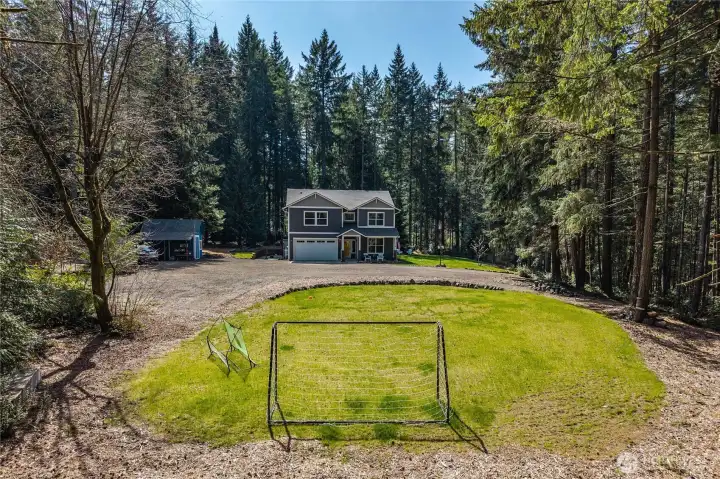 With over 2.4 acres, this property offers space all around for outside activity, homesteading dreams, entertaining, and simply enjoying your mini forest retreat.
