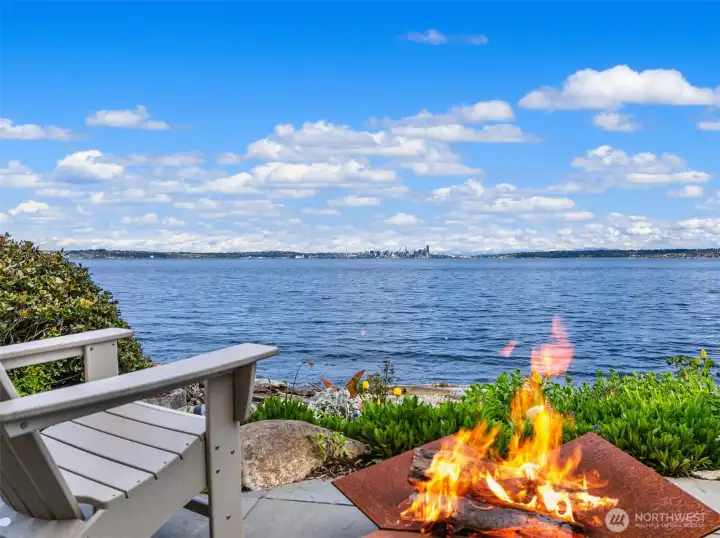 Bluestone patio with firepit at water's edge.