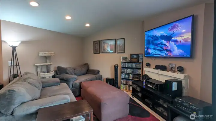 Vaulted ceiling living room with fireplace