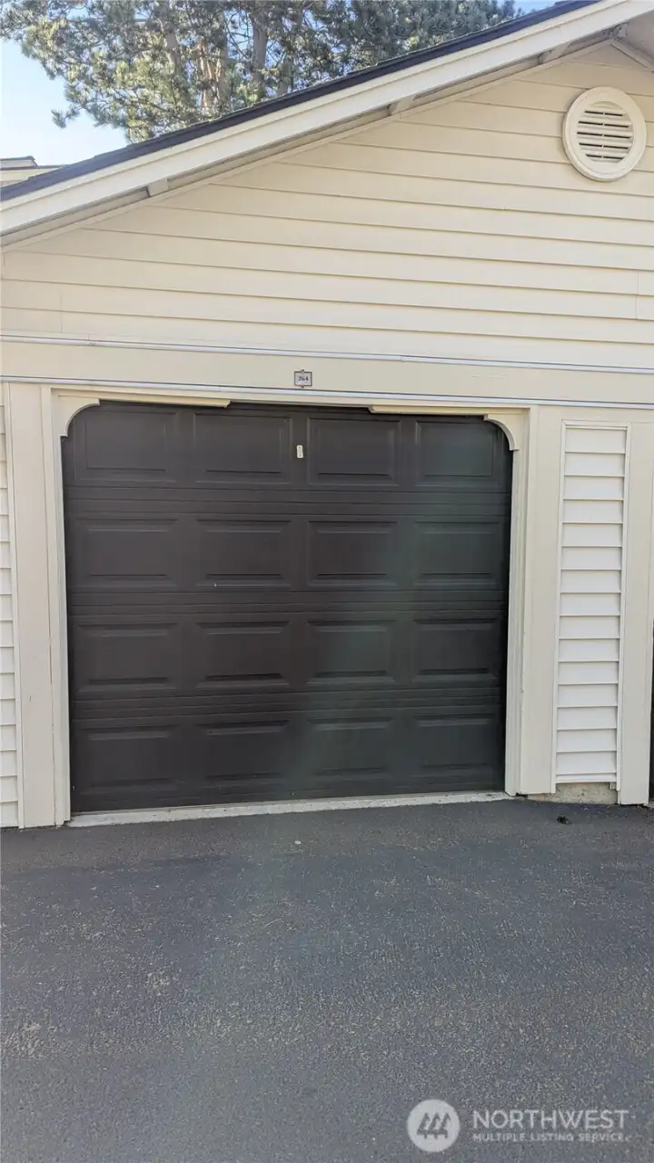 Garage is directly across  from parking space