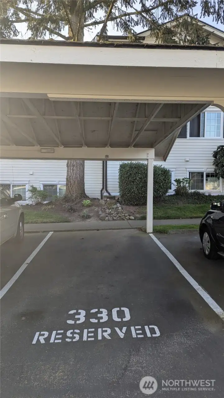 Covered parking spot right in front of access stairs