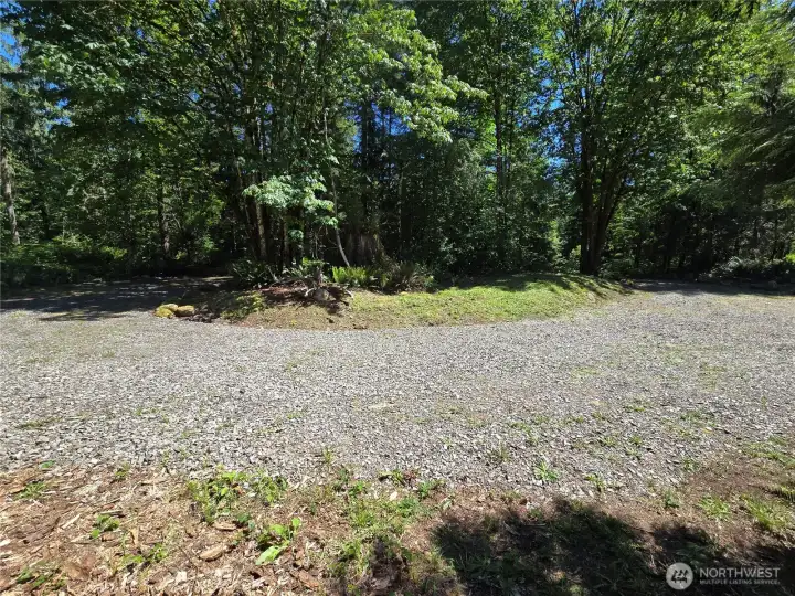Looking East at the circular driveway island. There is a large old growth cedar stump in the middle, but its hard to see in this photo.