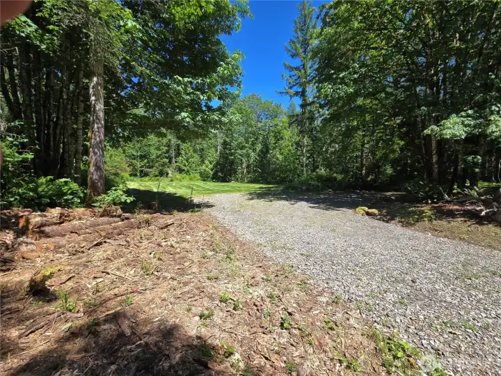 Looking north towards the home site. Driveway island on the right.