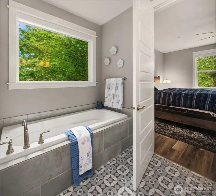 Soak to your content in the spacious tub Soak to your content in the spacious tub