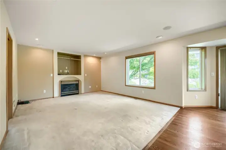 Family room with gas insert fireplace.  Home features built in speakers throughout.