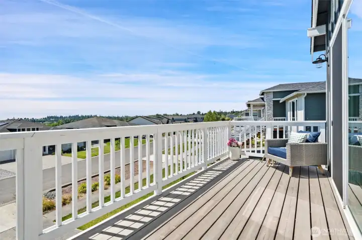 Access to front deck from both the primary suite and living room