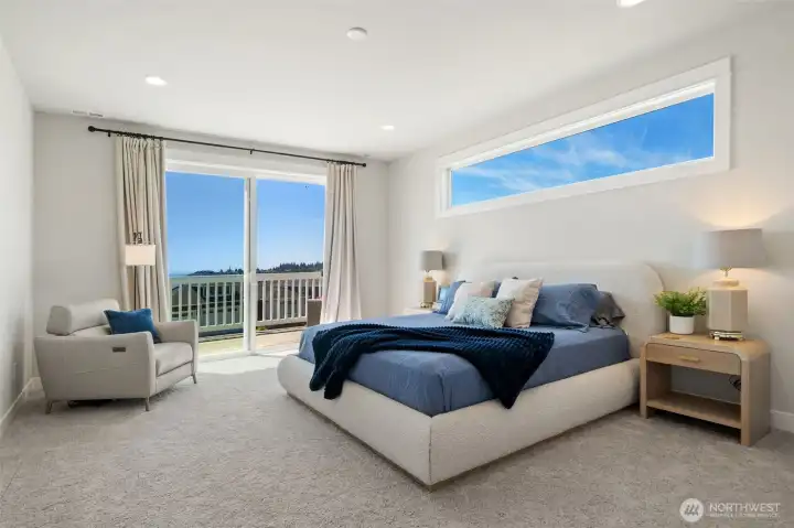 Primary bedroom with views of the bay