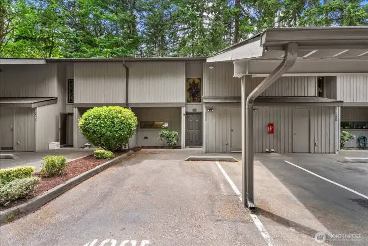2 dedicated parking spaces. Storage unit at the front of the covered parking space.
