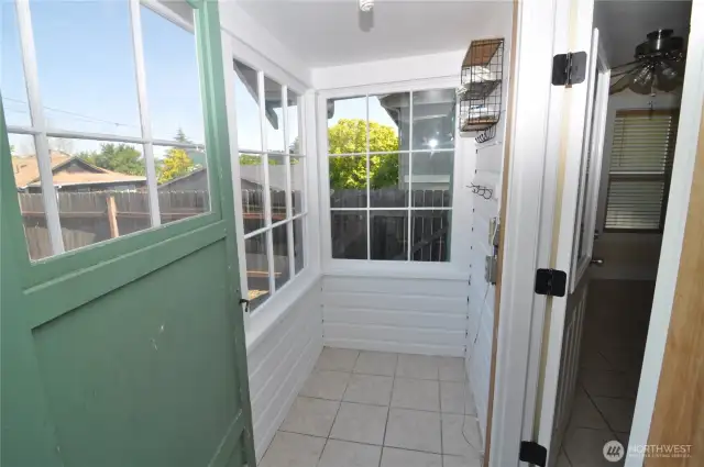 Tiny sunny enclosed porch would be great for plants!