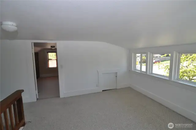 Flex space is bright. There is attic storage in each room upstairs.