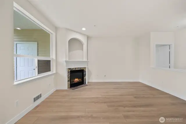 The living room is open to the hallway leading to the Primary ensuite