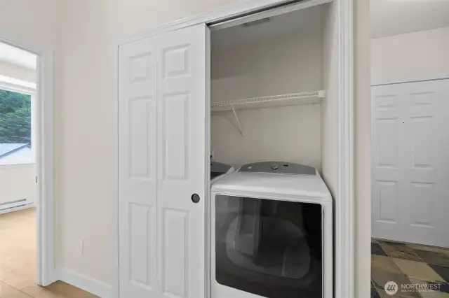 Almost new large capacity water and dryer. Front door to right of frame