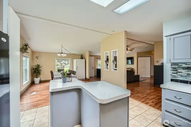 View from the kitchen into the dining and living rooms. Even when you're cooking, you can stay connected to family and guests.