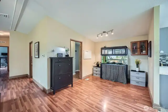 View into the bonus nook - great for a play area, home office, crafting, endless possibilities! The doorway on the left leads to the utility room and back door to the deck.
