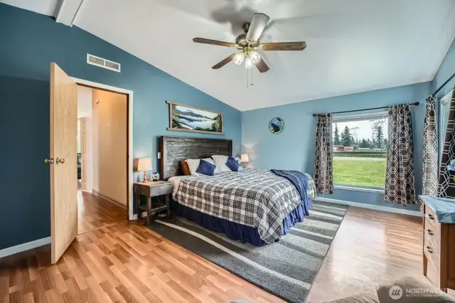 Spacious primary bedroom with lots of natural light.