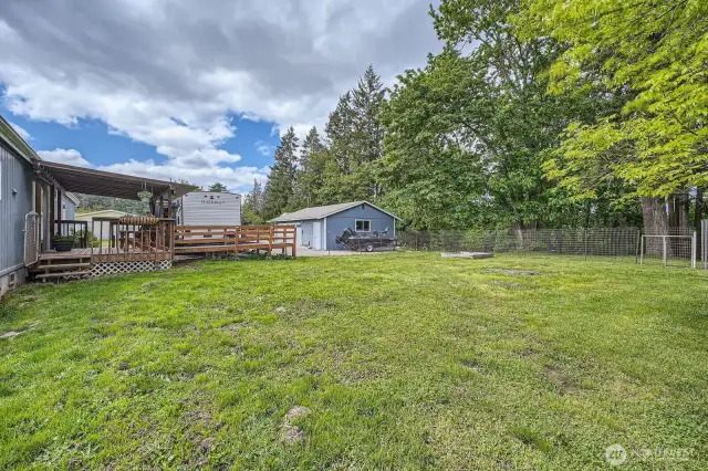 Lots of room to play or entertain! The ramp from the deck to the RV can stay or be removed. It simply provides access from the trailer to the house with no stairs.