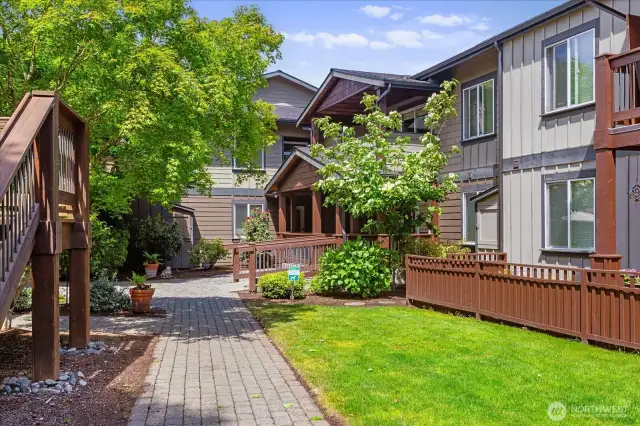 Well-maintained community. Walk way leading to the Carport - stall 124.