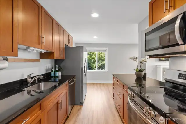 Lots of cabinets and onyx granite counters. Undermount sink.