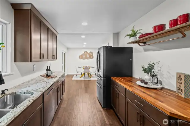 Great galley kitchen, with butcher block coffee bar.