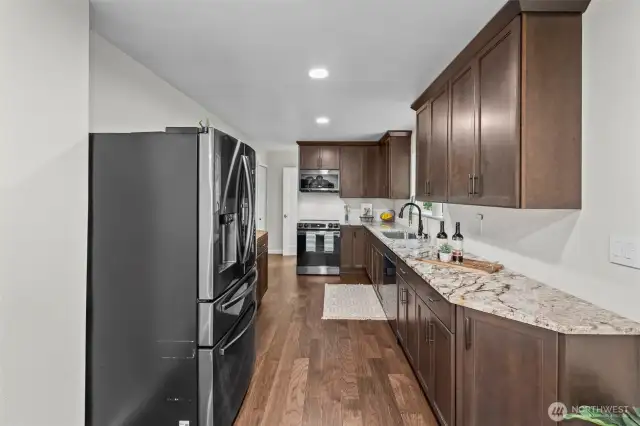 Granite countertops, beautiful cabinetry, and a great appliance package.