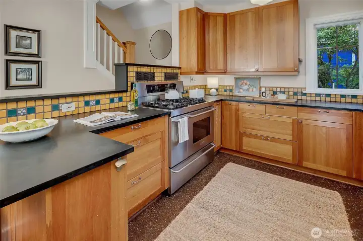 There are solid cherry wood cabinets, soapstone countertops, and tile from the Henry Mercer artisan tile factory.