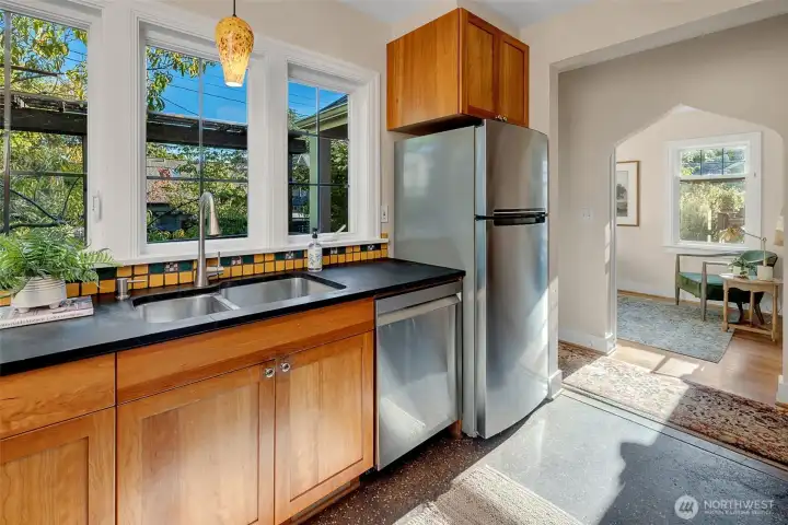 Enjoy a view of birds in the trees and raised beds while washing up.