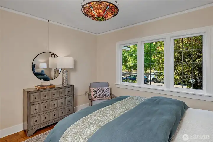 The main floor bedroom looks out onto the front garden.