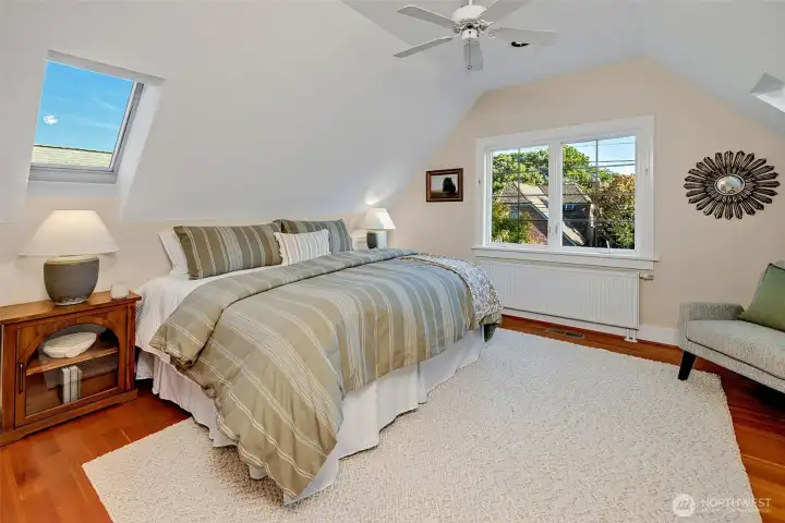 Upstairs, the primary bedroom overlooks the back garden.