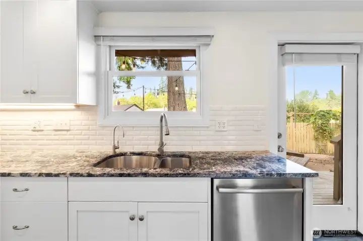 Lovely view of the deck and yard at the sink!