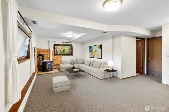 The large family room has a wood stove to warm you on chilly nights.  Plenty of room for multiple separate activities - games, reading or sipping hot chocolate by the stove!