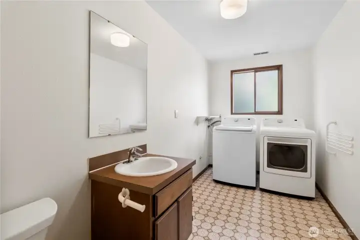 The huge laundry room also containes the downstairs half bath.l
