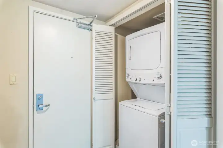 Conveniently situated near the elevator and refuse closet, this unit also includes a secure parking space and a dedicated storage room in the common garage, located just steps from the entry for added ease and accessibility.