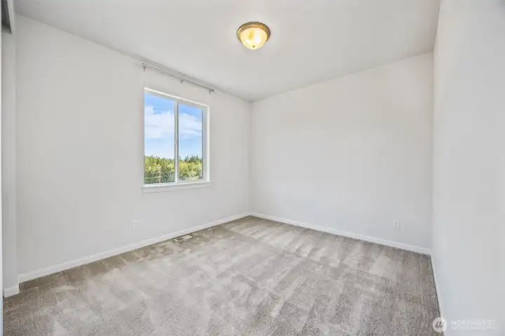 one of two upper bedrooms