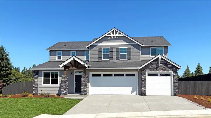 Gorgeous stonework facade with 3 car garage and more room to add add additioan parking on the side.