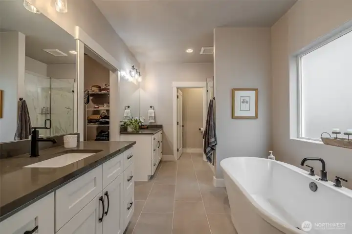 This bathroom is a retreat! Double sinks with great storage, soaking tub, tiled shower, water closet.