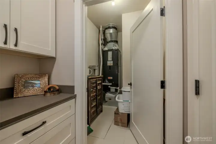 Additional storage in this closet. Door to the right goes out to garage