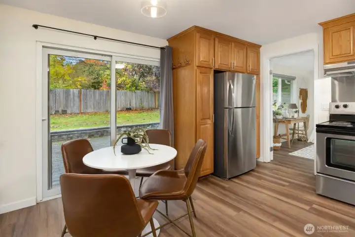 Slider off the kitchen leads to the expansive backyard.