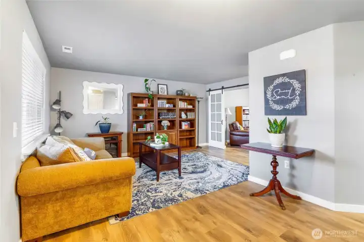 Living room adjoins office space.