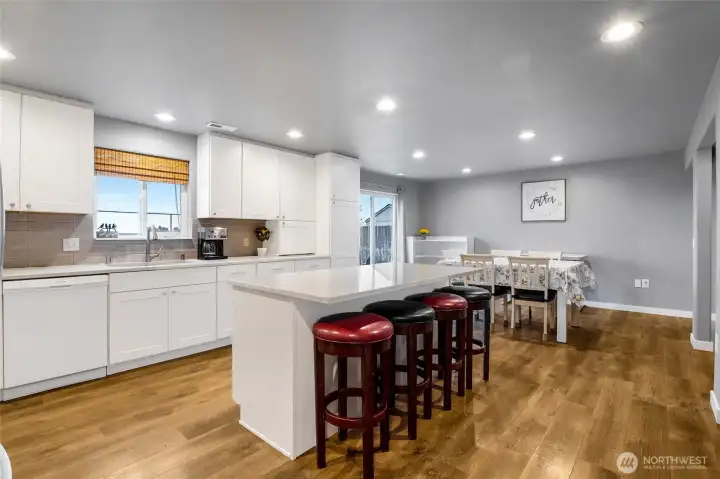 Beautifully updated kitchen white cabinets and quartz countertops.