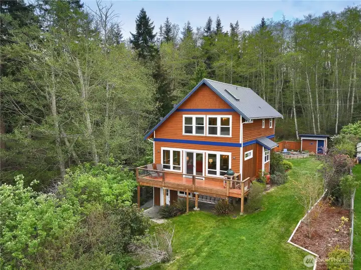 Back of home with deck