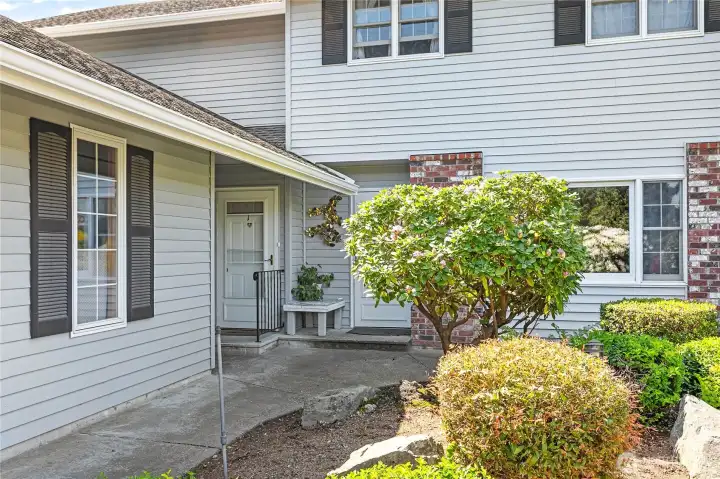 The home entrance is the door to the far left. The garage is on the left hand side.