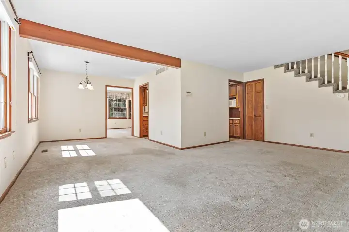 This home has a large living room with a dining area large enough to entertain a big gathering of guests.
