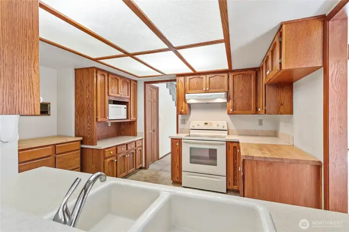 Kitchen is located off of dining room area.