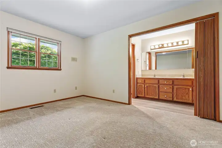 Master bedroom with access to the master bathroom.