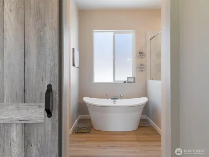 There is grand entrance to the primary bath/shower area. There is grand entrance to the primary bath/shower area.