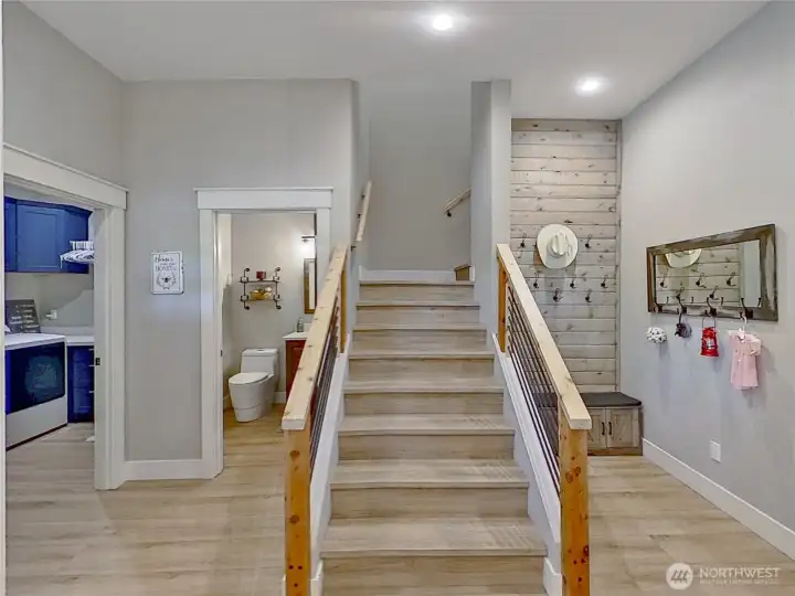 Exit to garage on right and stairs to flex room upstairs. Exit to garage on right and stairs to flex room upstairs.
