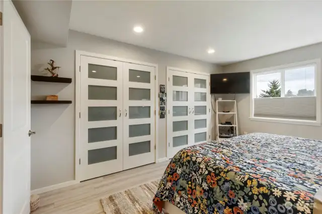 Extra large primary bedroom with custom closet doors.  Perfect to add your own custom interior closet features.