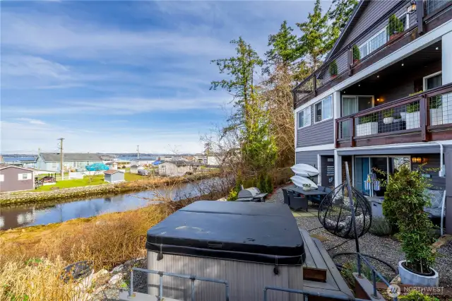 Watch the sunset over the bay while you relax in your private hot tub