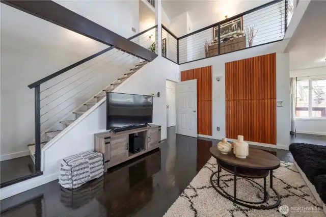 Vaulted ceilings and an open-concept layout enhance the natural light and stunning views.