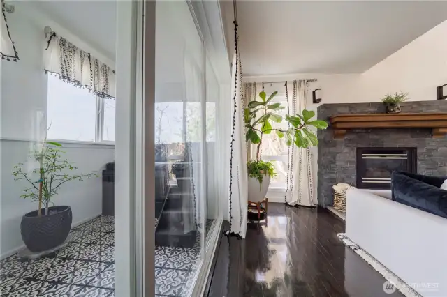 Surrounded by windows, this sunroom brings the beauty of the outdoors inside.